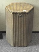 A Lloyd Loom linen basket, of hexagonal form,