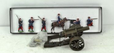 A group of Britains toys including a WW1 field cannon with bullets and lead Foreign Legion soldiers
