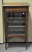 A Victorian mahogany display cabinet, glazed door, adorned throughout with inlay details,