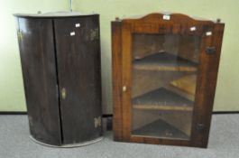 A bow fronted corner cabinet and a glazed corner cabinet,