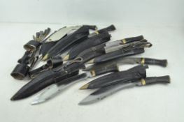 A collection of seven Kukri swords/daggers, each with original leather scabbards,