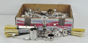 A large collection of silver plated wares, including candlesticks,