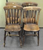 A set of four lathe back elm kitchen chairs, with turned legs,