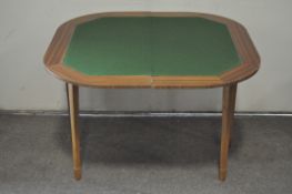 An inlaid mahogany folding card table, raised on tapering supports,