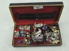 A vintage box of assorted earrings,