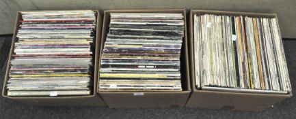 Three boxes of vintage vinyl's, covering a range of styles and artists, including Classic Rock,