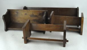 Four 20th century wooden book troughs/shelves, various sizes, one with carved floral sides,