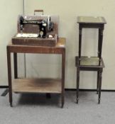 A Singer sewing machine (locked, no key), in original case,