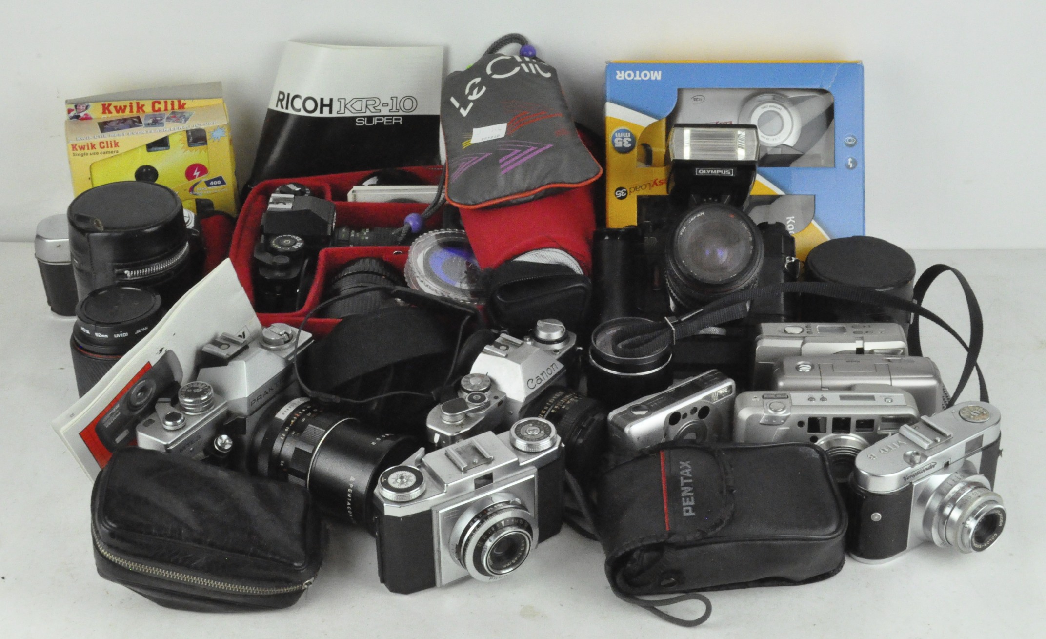 A selection of assorted cameras and related equipment, including an Olympus OM 40 film camera,