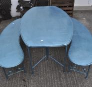 A blue painted garden table and two curved benches,