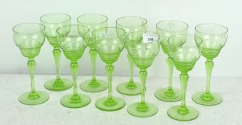 A set of ten long stemmed green wine glasses by Stuart, on circular feet,