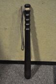 A wooden truncheon with leather handle,40 cm long, and a wood swagger stick with metal encased ends,