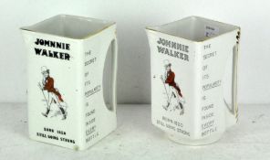 Two Johnnie Walker pouring jugs "The secret of its popularity is found inside every bottle,