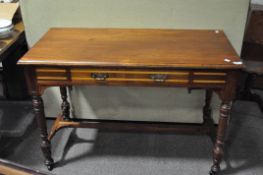 A late 19th/early 20th century mahogany desk with cross banded detailing to single long draw to