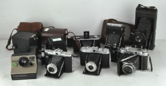 A large collection of cameras, to include a Zeiss Ikon Nettar, Solida III folding camera,