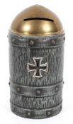 A novelty, trench art style tin money box, in the form of a shell with a German Cross to the front,