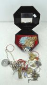 An assortment of vintage costume jewellery, including chains,