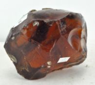 A piece of unusual amber coloured art glass of abstract form,