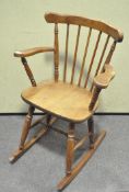 A 20th century pine rocking chair,