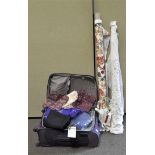 A suitcase containing various materials and balls of wool,