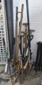 A collection of garden tools, including: shears, spades,