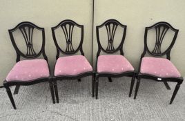 Four Sheraton style reproduction stained wood chairs, with upholstered seats,