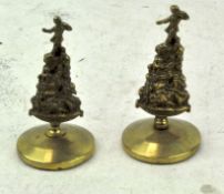 Two late 19th/early 20th century brass Peter Pan paperweights, rd no 709324,