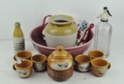 A selection of ceramics, including a large pink wash bowl, a part coffee set,