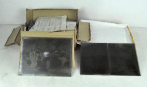 A collection of 19th century black and white photographic slides,