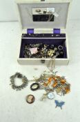Assorted vintage costume jewellery, including earrings, a cameo brooch and other pieces,