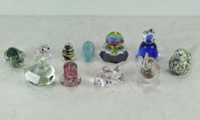 A collection of assorted glass animals and paperweights, including a seal,