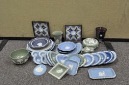 A large quantity of Wedgwood green and blue Jasperware plates, dishes, boxes and vase,