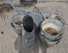 A collection of galvanized items, including buckets in sizes,