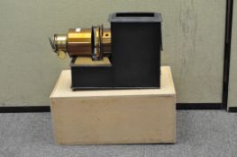 A magic lantern projector, with a brass lens,