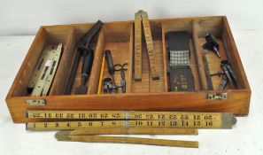 A collection of vintage tools, including three brass mounted spirit levels, one by J Rabone & Sons,