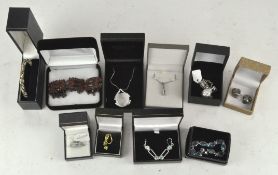 A group of costume jewellery including bracelets, pendants, a bangle and more,