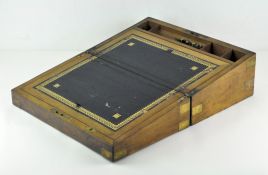 A walnut writing slope with an inlaid brass shield to top, marked 'Roan Prize 1885',