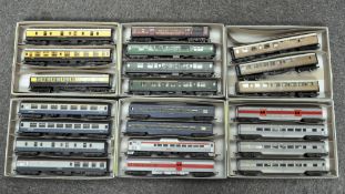 Over twenty 00 gauge train carriages, including a Triang Trans-Continental baggage and carriage car,