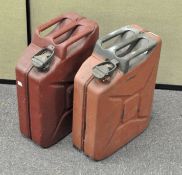 Two jerry cans, one painted red, the other orange over green,