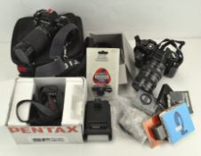 A quantity of cameras and related accessories, including a Chinon Super power-winder, Chinon CE-5,