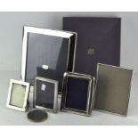 A group of contemporary silve-plated photograph frames,