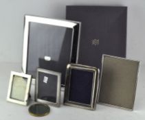 A group of contemporary silve-plated photograph frames,