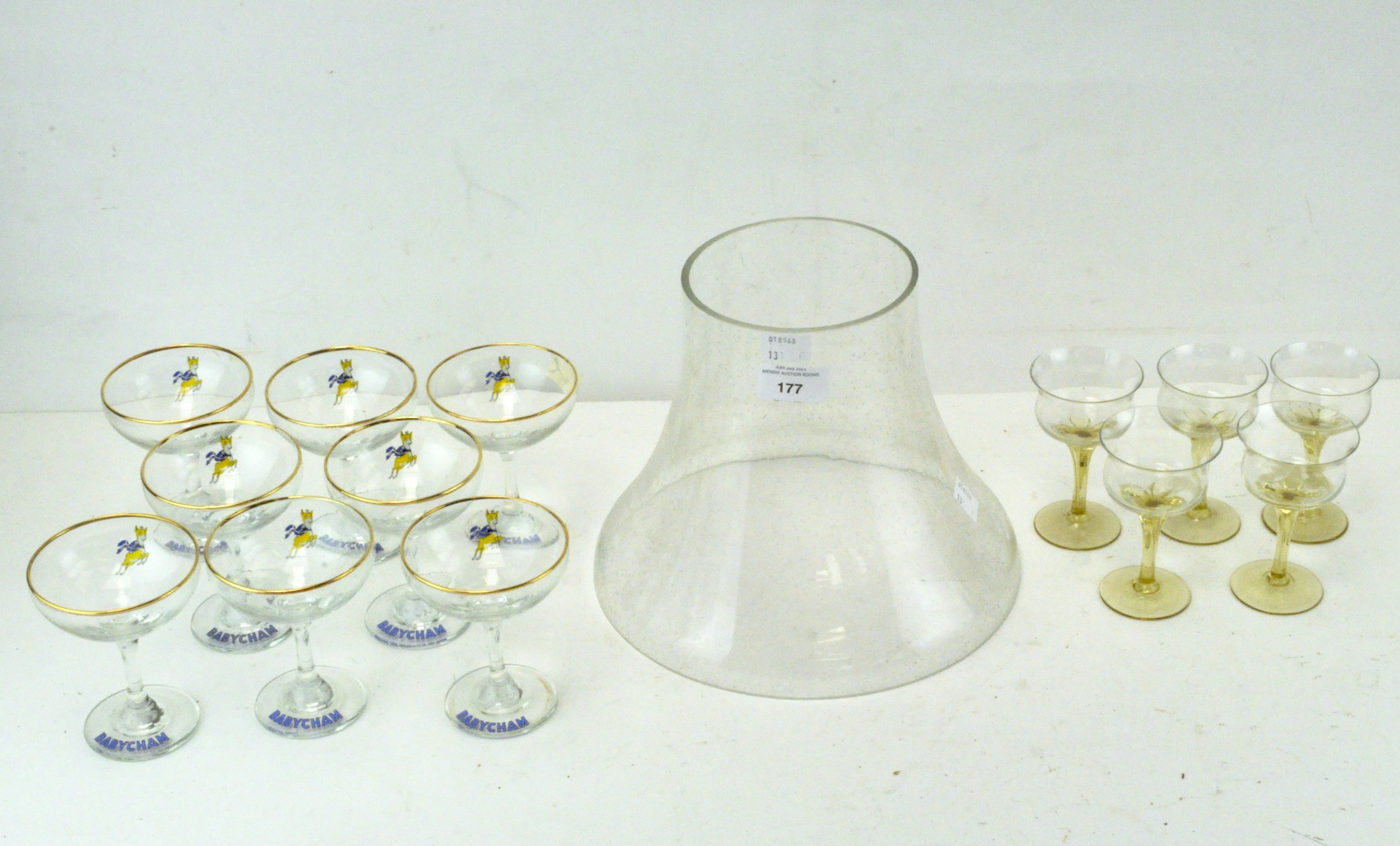 A collection of mixed glassware, including eight Babycham coupes,