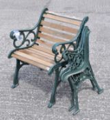 A green painted garden single seat bench and a separate set of green painted bench ends