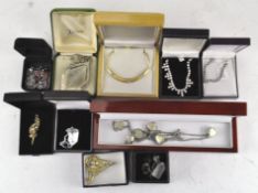A group of costume jewellery including necklaces, a pair of silver mounted earrings,