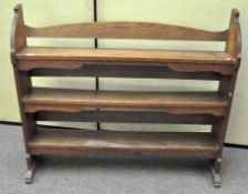 An oak bookshelf with three shelves,