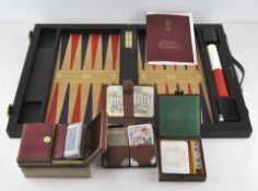 A Crockfords backgammon set, in original case; together with three card games,