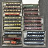 A group of 00 gauge carriages and sleeping cars, in LMS, GWR and other liveries,