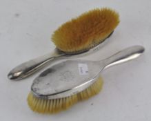 A pair of early 20th century silver mounted hair brushes, hallmarked London 1913,