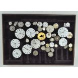 A collection of watch faces, of assorted sizes, materials and designs